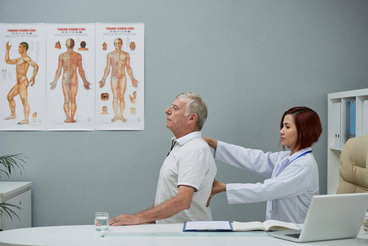 chiropractor-checking-spine-1200x801.jpg