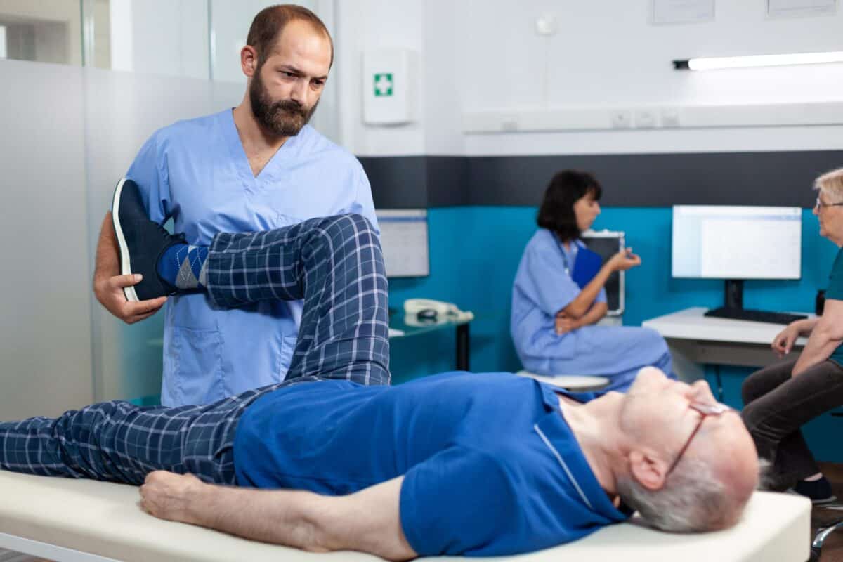 orthopedic-specialist-assisting-old-patient-with-leg-joint-injury-1200x800.jpg